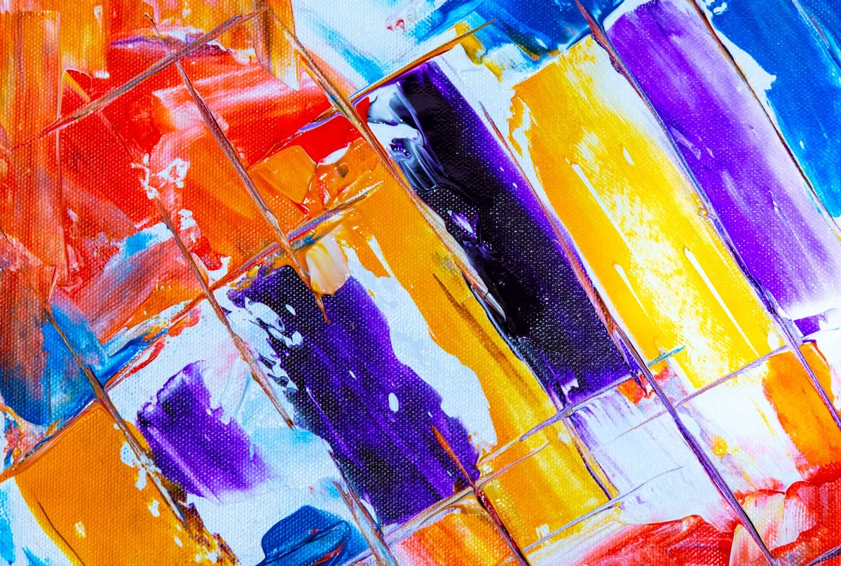 Gallery-style wall display of abstract artworks with proper directional lighting