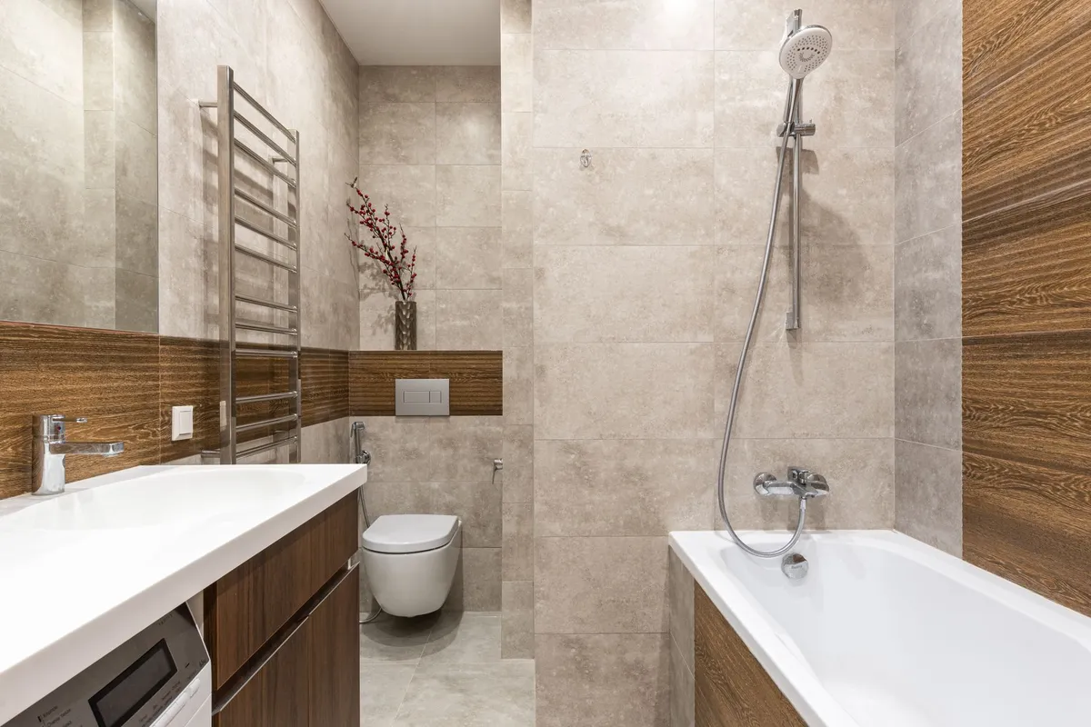 Modern small bathroom with floating vanity and vertical subway tile