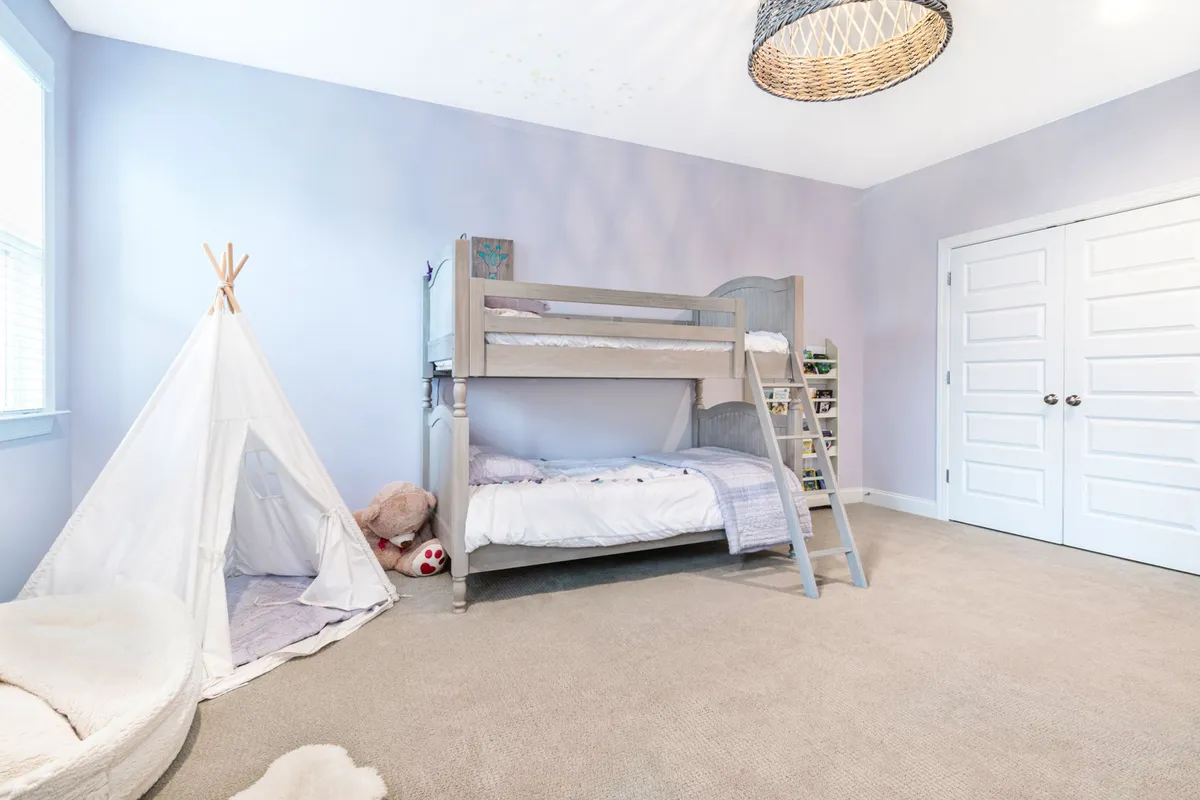 Bright children's bedroom with adaptable neutral base and colorful accent decor