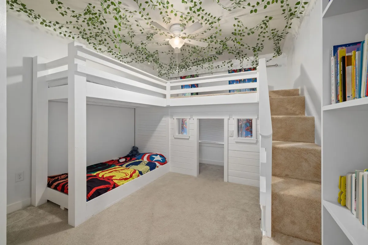 Playful children's room with organized storage wall and reading nook corner