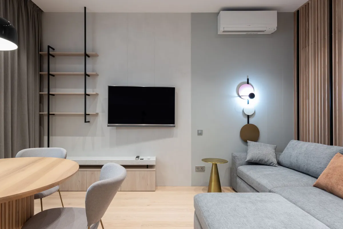 Modern living room redesigned with AI visualization showing clean lines, natural wood furniture and neutral palette