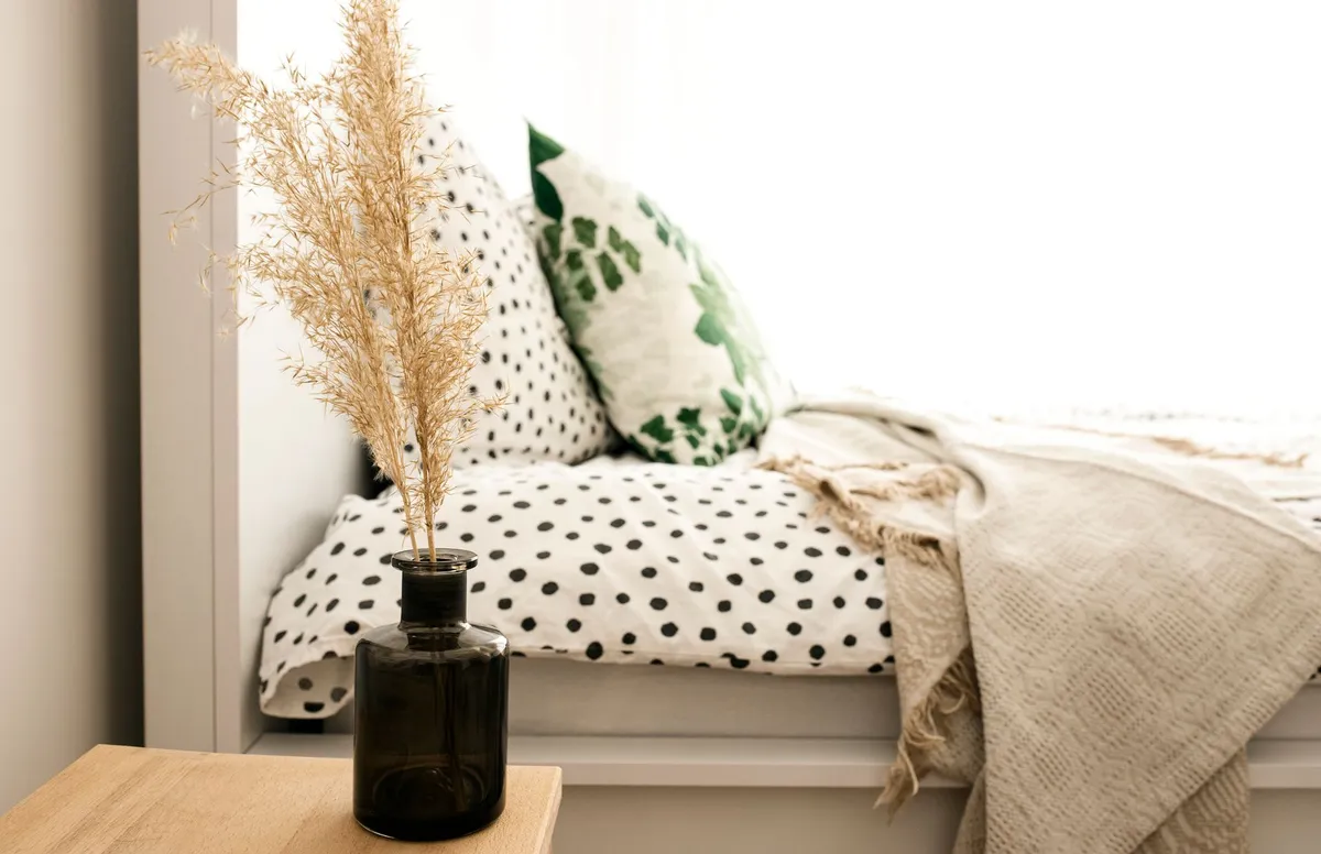 Master bedroom sanctuary with layered lighting and upholstered headboard