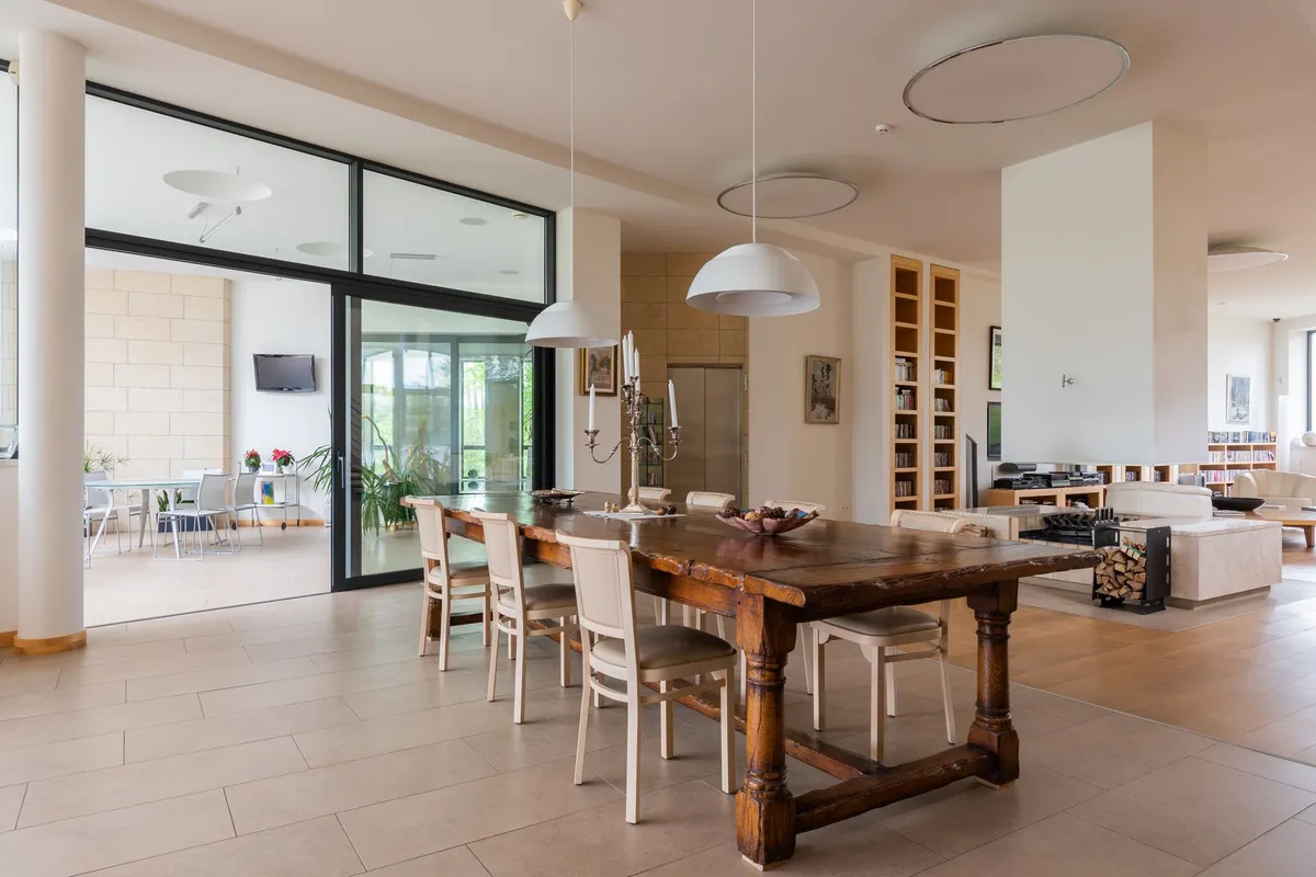 Dining room with mixed seating and natural wood table