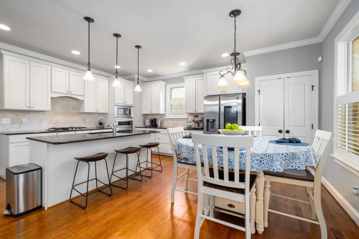 Modern dining room renovation with open layout, contemporary pendant lighting, and family-scale table