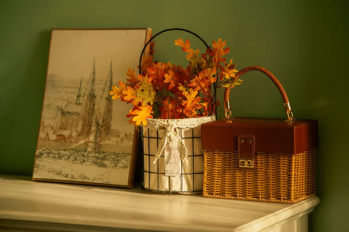 Seasonal autumn home decor with warm colors and natural elements on coffee table
