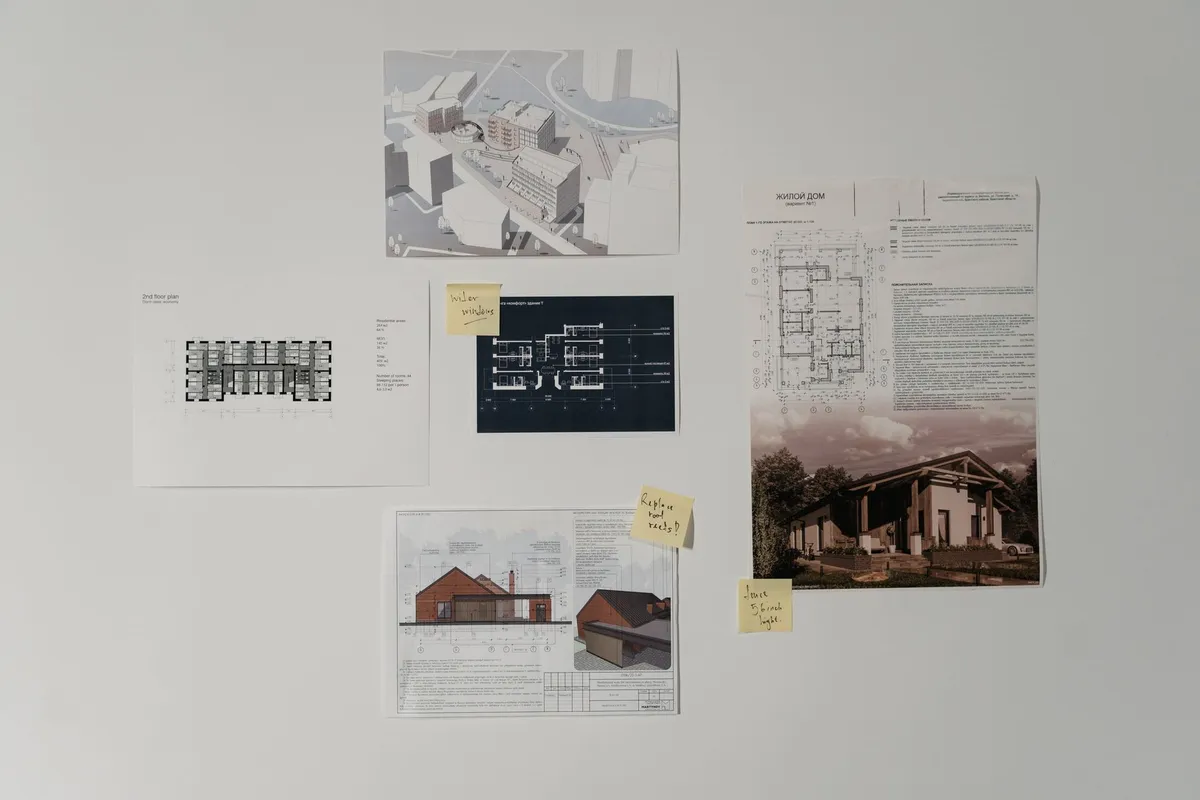 Room design planning with visualization tools and material samples laid out on a table