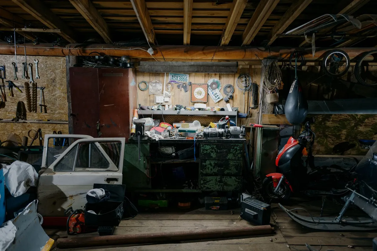 Organized garage workshop with wall-mounted tool storage and work bench