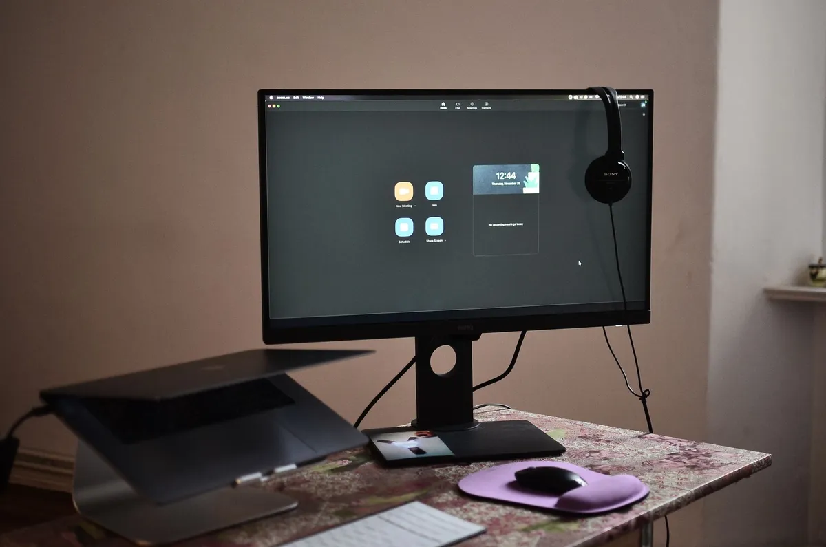 Organized home office with ergonomic desk setup and professional lighting