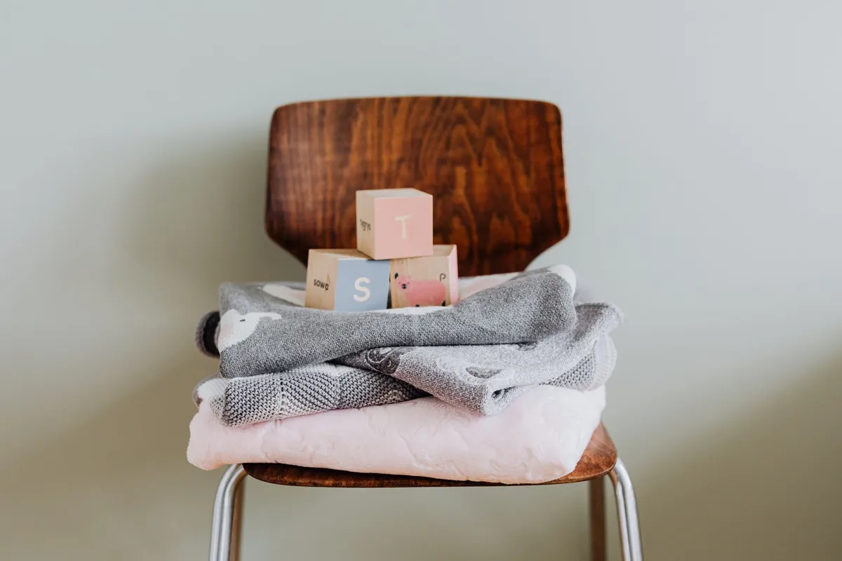 Beautifully designed nursery with natural wood, soft lighting, and organized storage