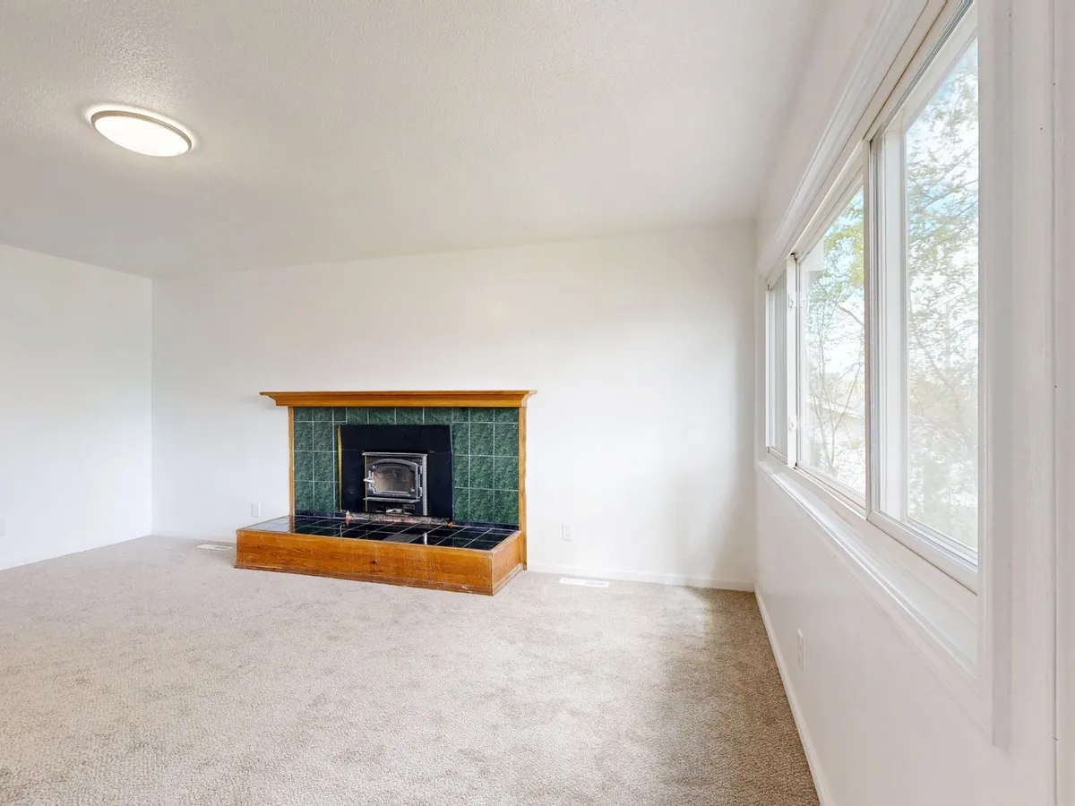 Professionally staged living room with neutral furniture and clean styling for home sale