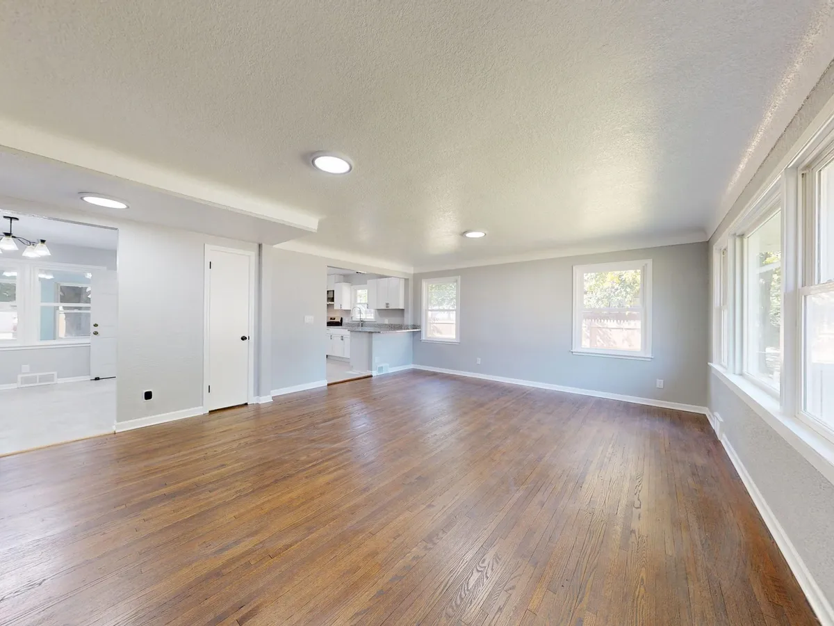 Virtually staged dining area with modern furniture and warm lighting for real estate listing