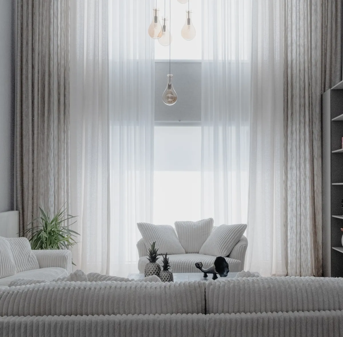 Well-lit modern living room photographed from corner showing full space