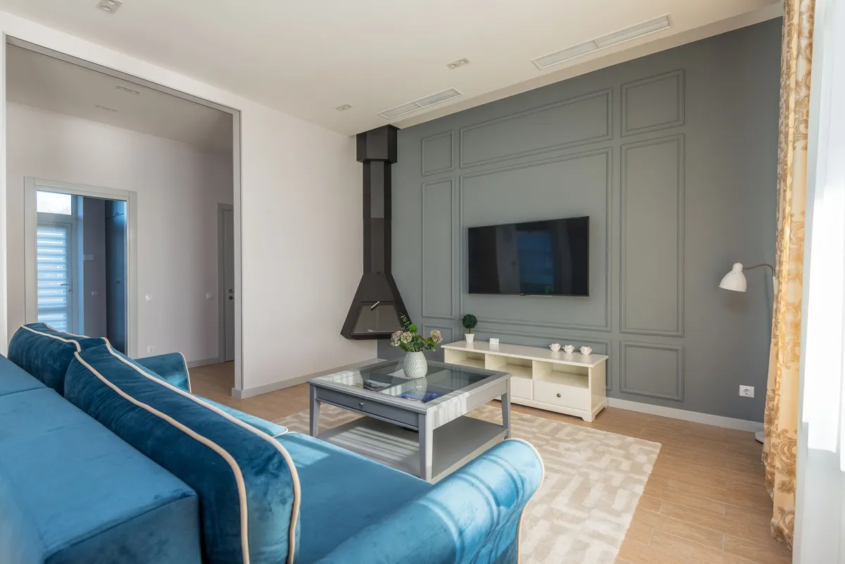 Before and after room comparison showing AI redesign transformation result