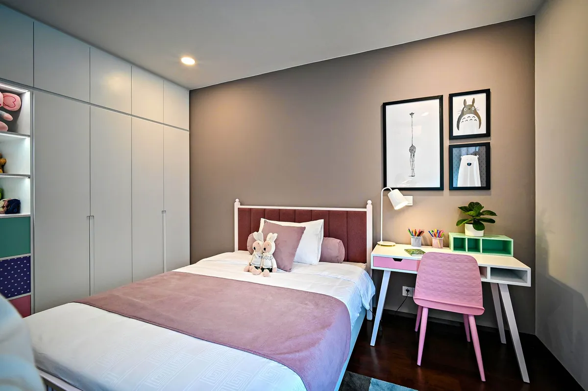 Kids room with floor-to-ceiling built-in storage wall open shelving desk and loft bed