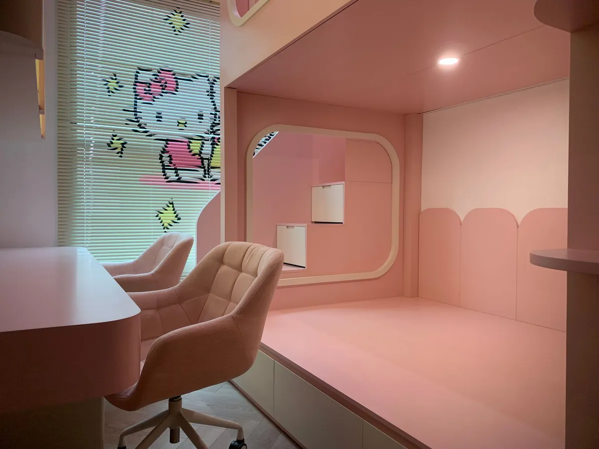 Shared kids room with twin bunk beds built-in storage and divided personal zones