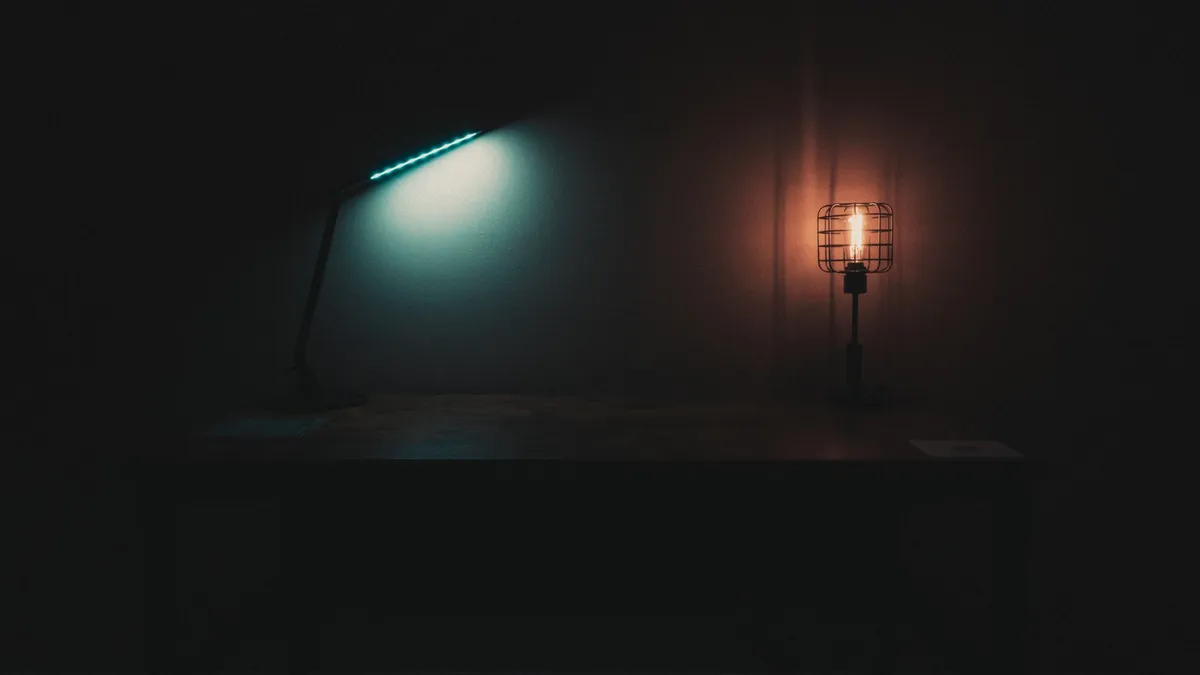 Dining room with warm pendant lighting dimmed for an intimate evening setting