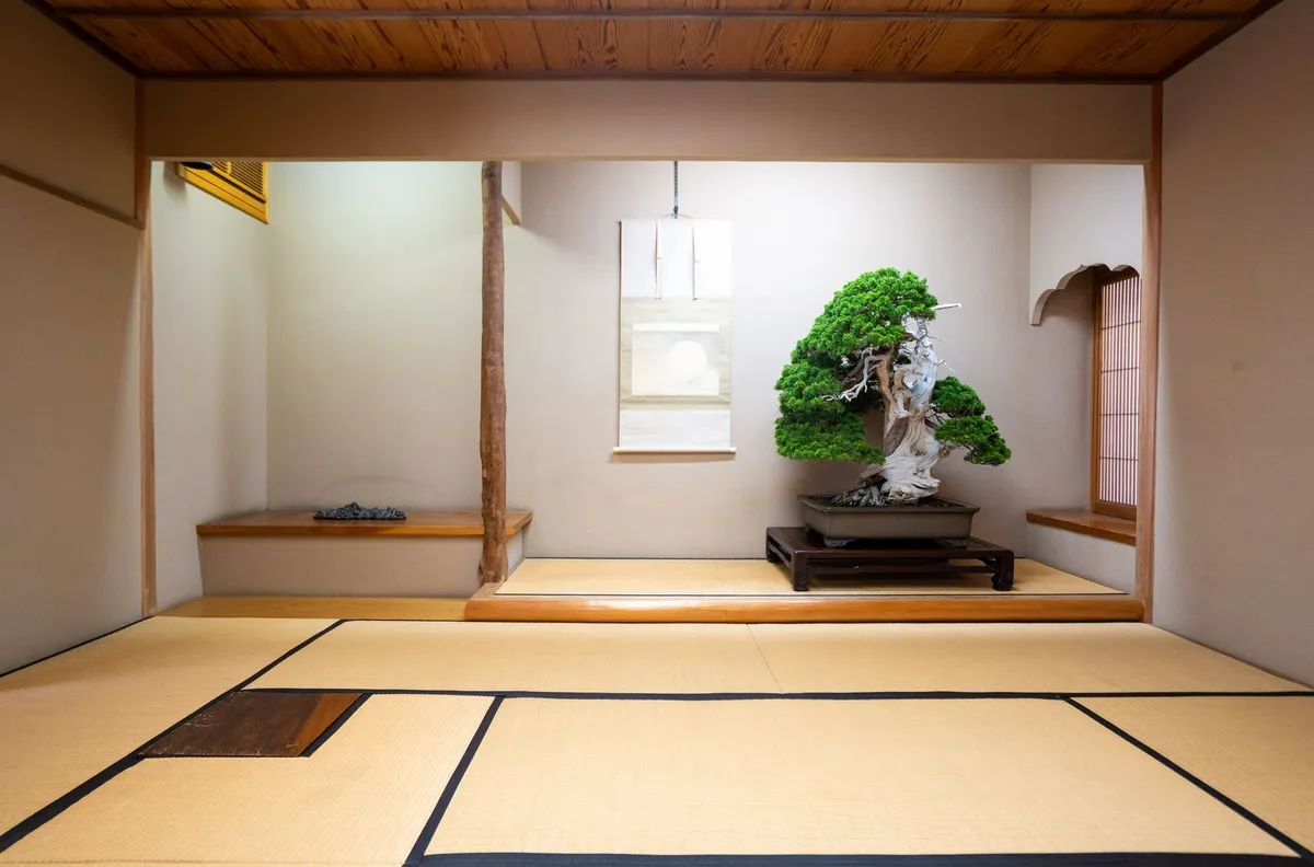 Minimalist Japanese-inspired interior with natural wood, neutral textiles, and clean lines