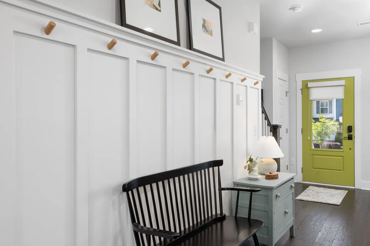 Well-organized mudroom with built-in lockers, bench, and shoe storage