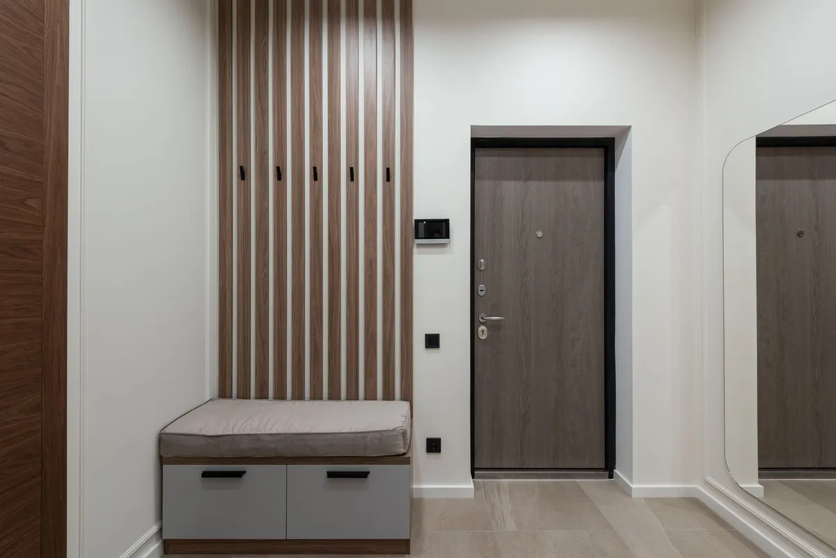 Mudroom command center with hooks, mail station, and charging zone