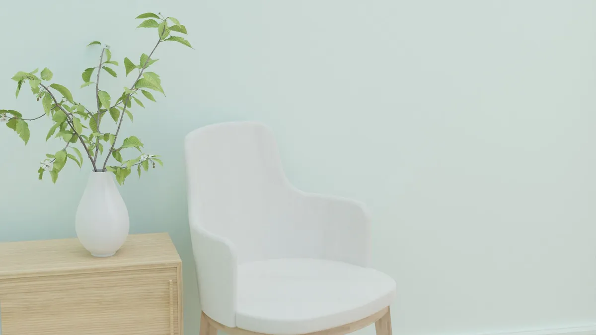 Scandinavian living room with light birch floors, white walls, and natural linen cushions