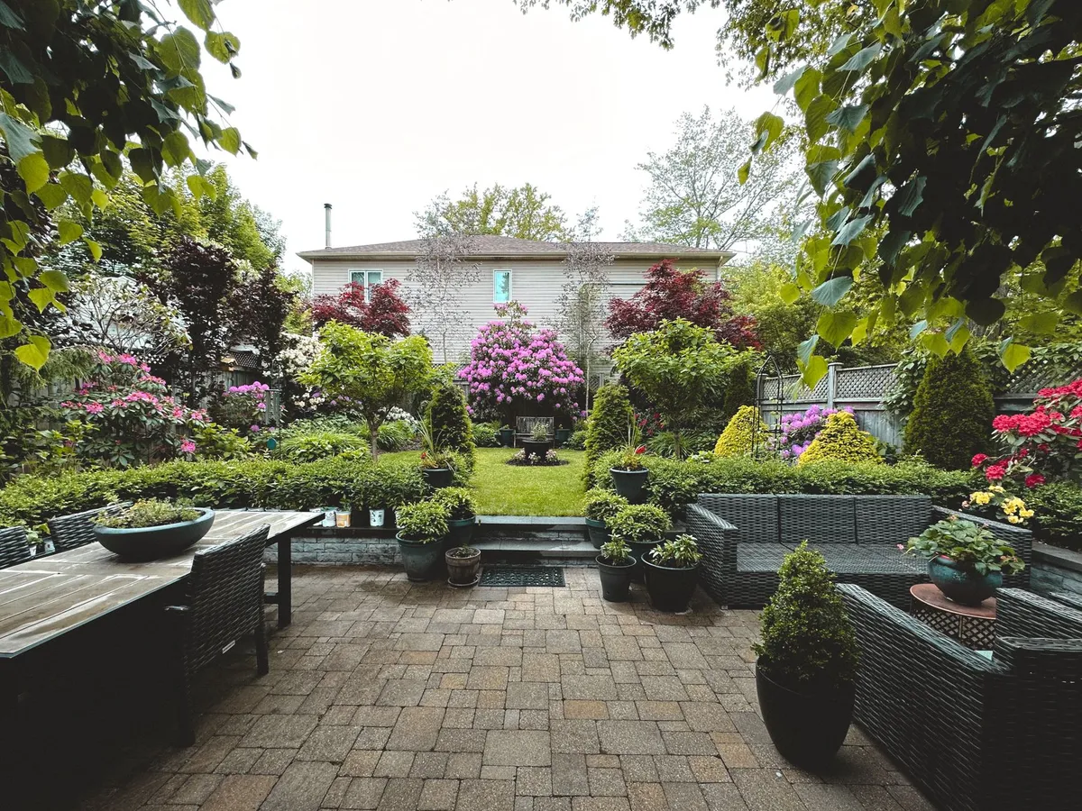 Summer patio with outdoor furniture and beautiful landscaping