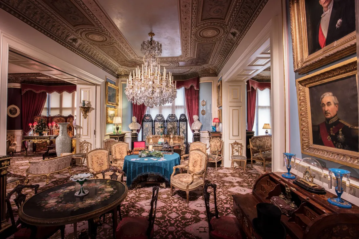 Victorian room details with ornate molding and period furniture