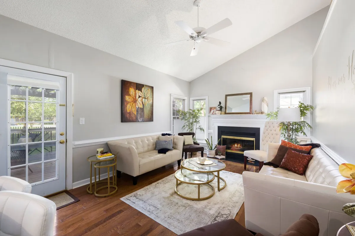 Virtually staged living room showing empty space transformed into a modern furnished interior for real estate listing